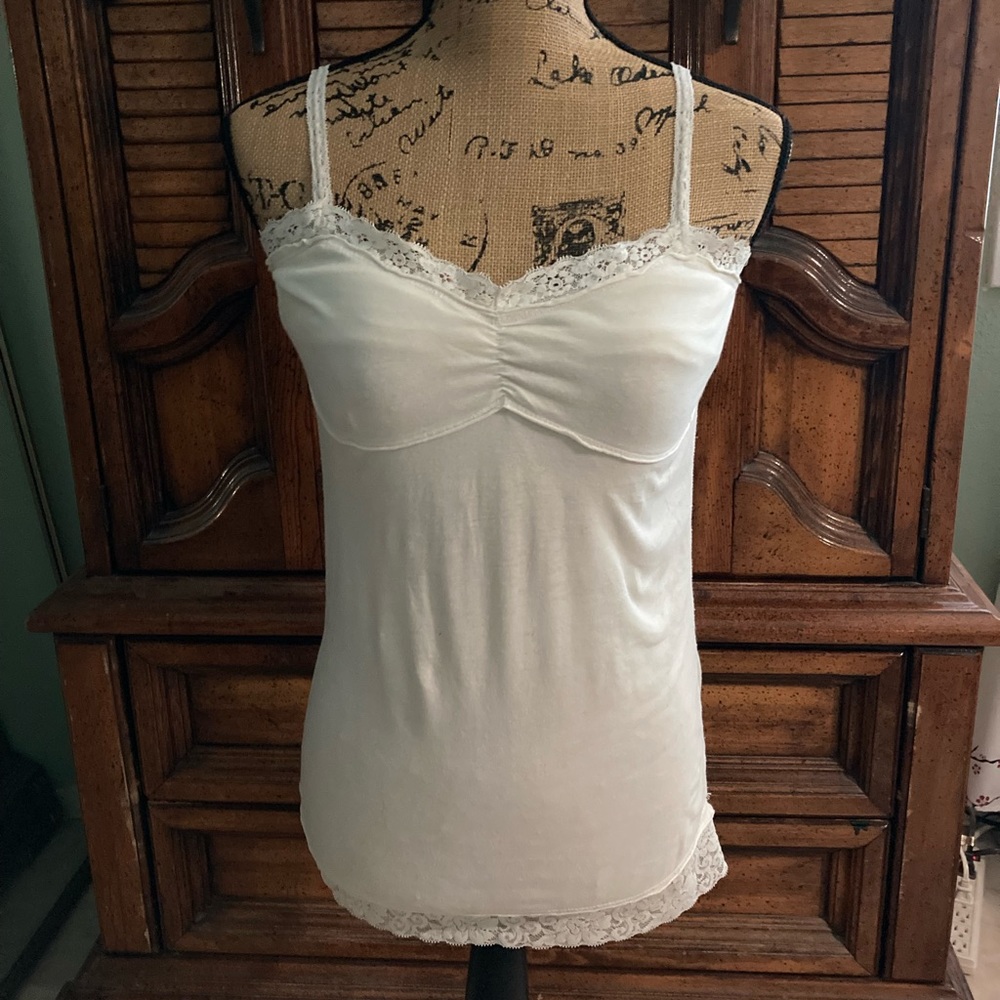 Woman’s cotton/polyester top, size @ a medium.